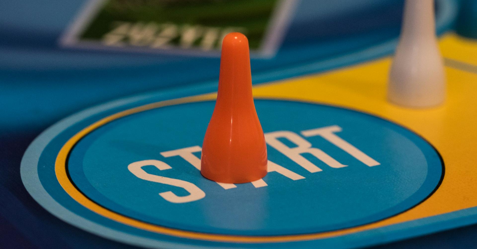 a close up of a game board with two cones